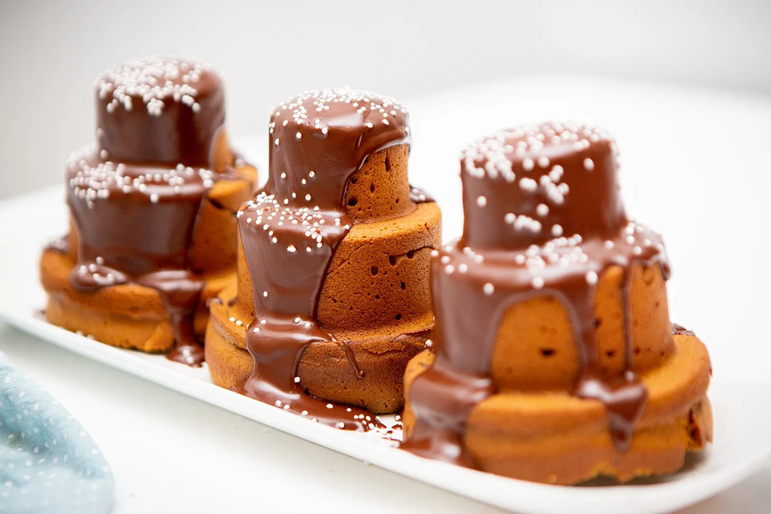 Ginger spice cakes topped with chocolate ganache