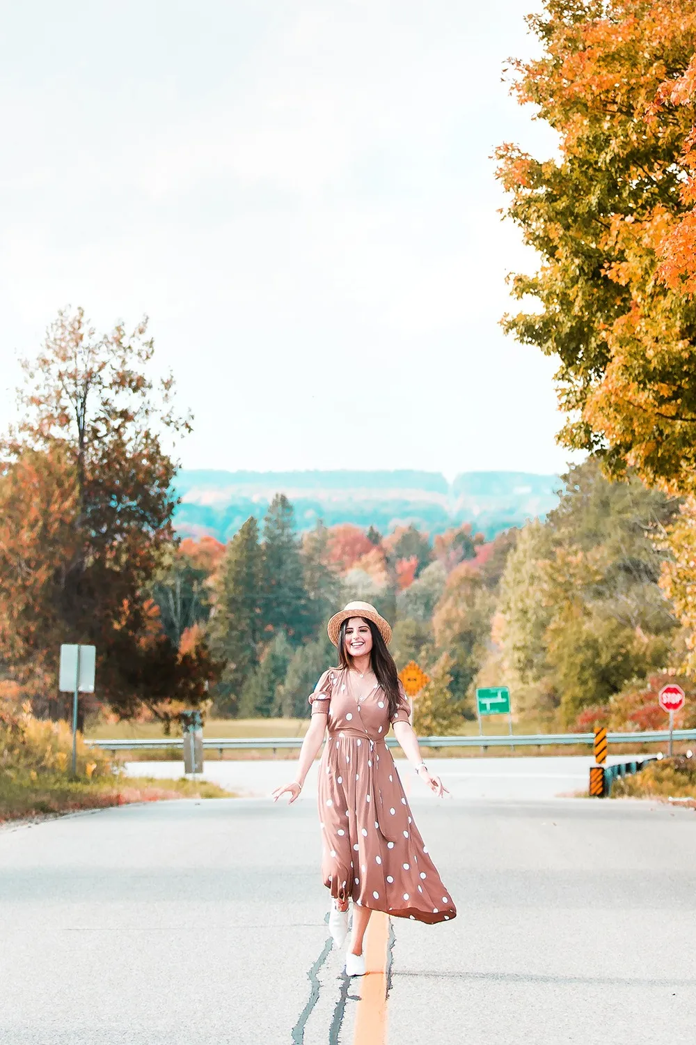Warm fall fashion among autumn leaves