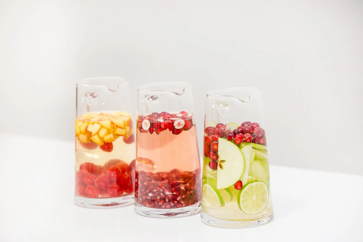 Holiday sangrias garnished with fresh fruit