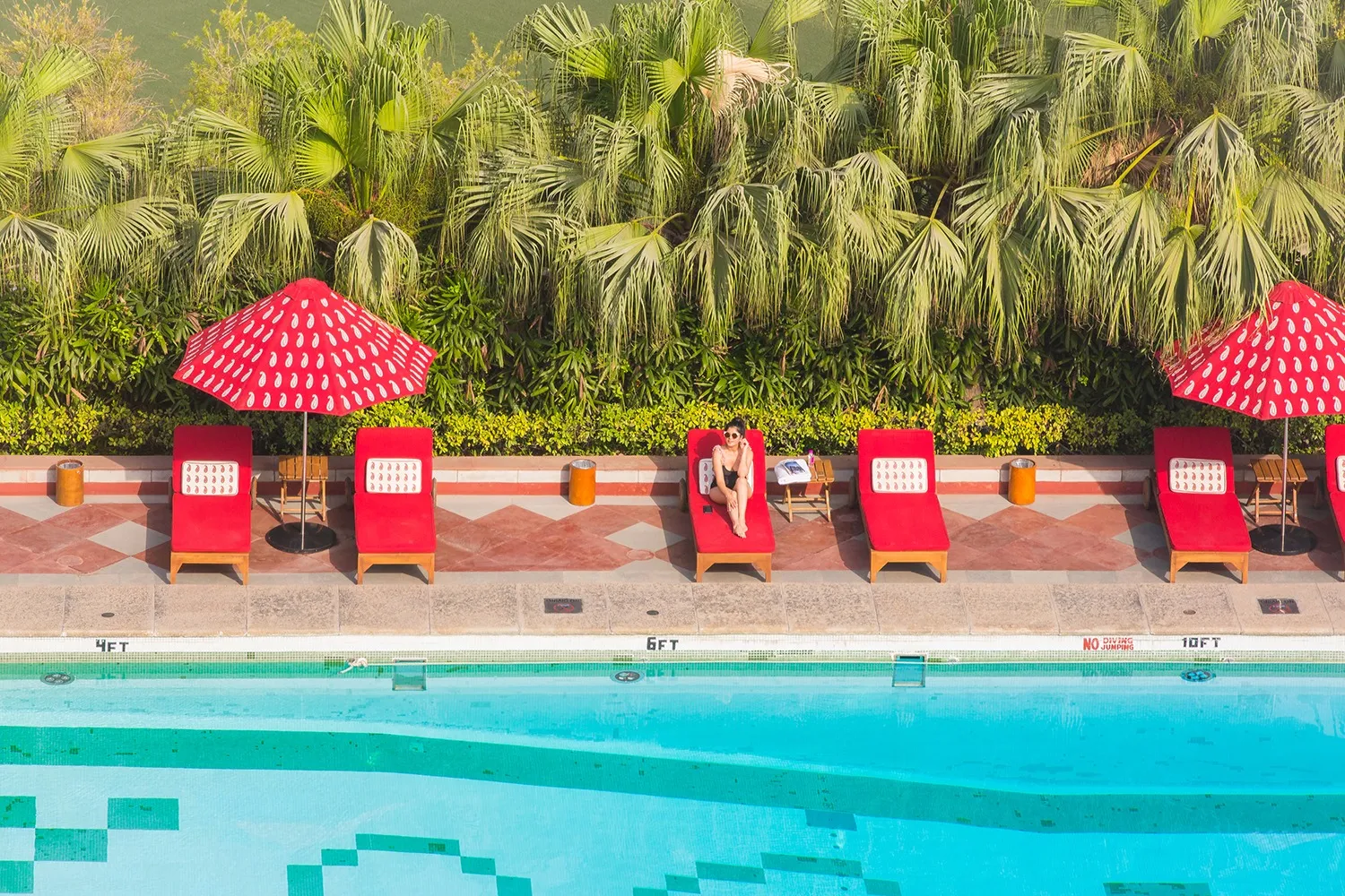 Relaxing by the hotel pool in New Delhi