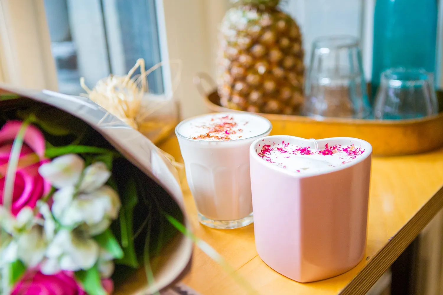 Chai latte in a pink heart-shaped mug